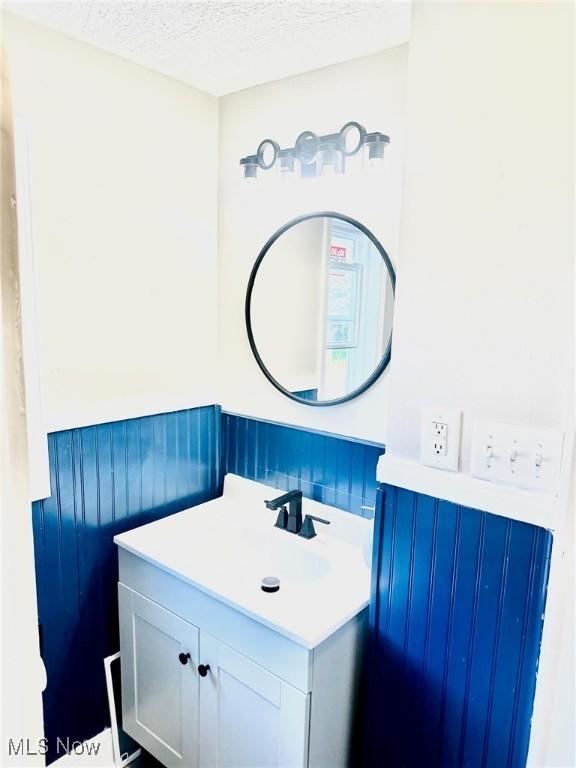 1389 Diagonal Rd, Akron, OH 44320 - bathroom featuring vanity and a textured ceiling