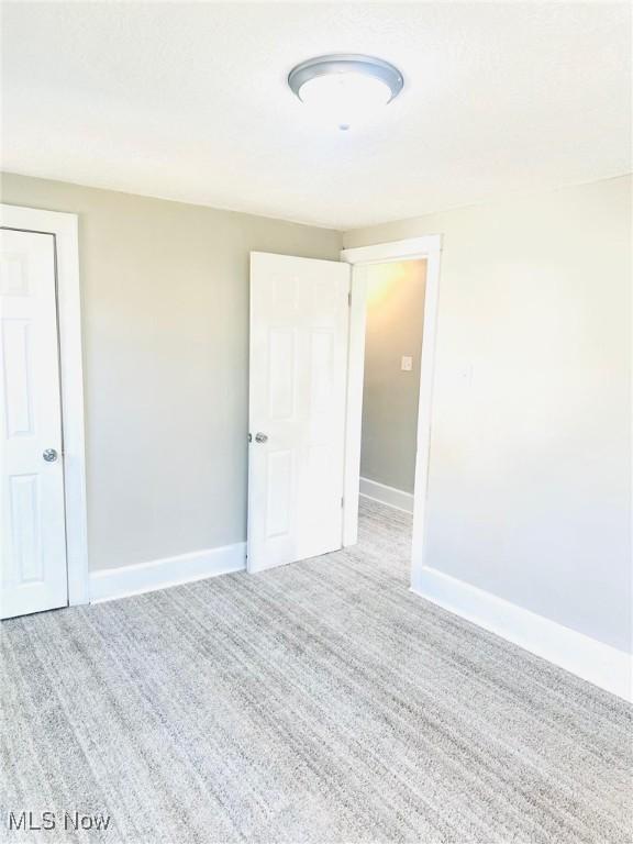 1389 Diagonal Rd, Akron, OH 44320 - carpeted spare room with baseboards