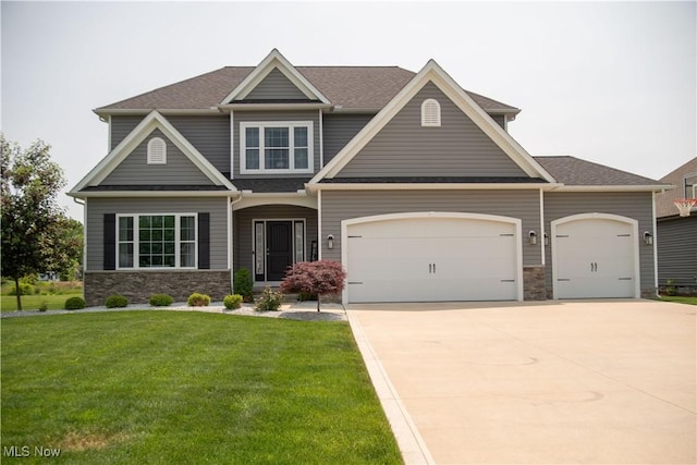 8224 Lilly Ln, Concord, OH 44077 - craftsman-style house with stone siding, a front lawn, a garage, and concrete driveway