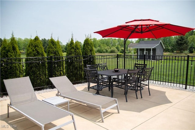 8224 Lilly Ln, Concord, OH 44077 - view of patio with an outbuilding and outdoor dining space