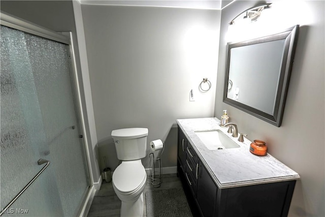 8224 Lilly Ln, Concord, OH 44077 - full bathroom with toilet, vanity, a shower stall, and baseboards