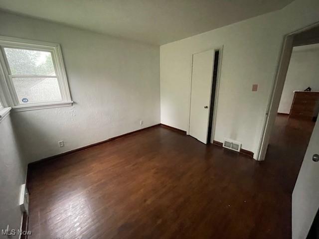 48555 Calcutta Smithferry Rd, East Liverpool, OH 43920 - unfurnished bedroom with dark wood finished floors and baseboards