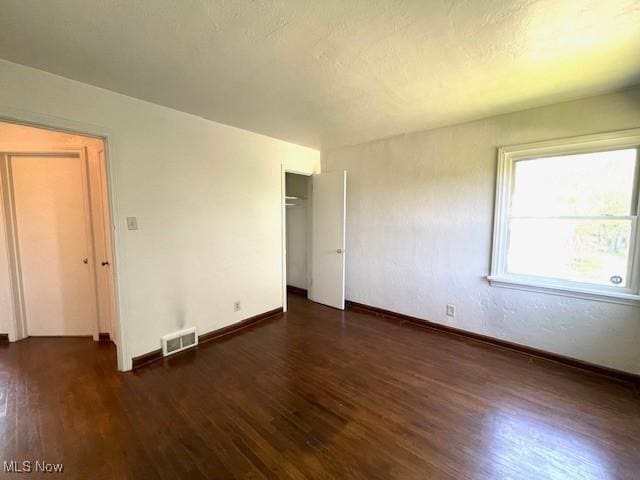 48555 Calcutta Smithferry Rd, East Liverpool, OH 43920 - unfurnished bedroom with wood finished floors, baseboards, and a closet