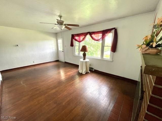48555 Calcutta Smithferry Rd, East Liverpool, OH 43920 - unfurnished living room featuring wood finished floors, ceiling fan, and baseboards