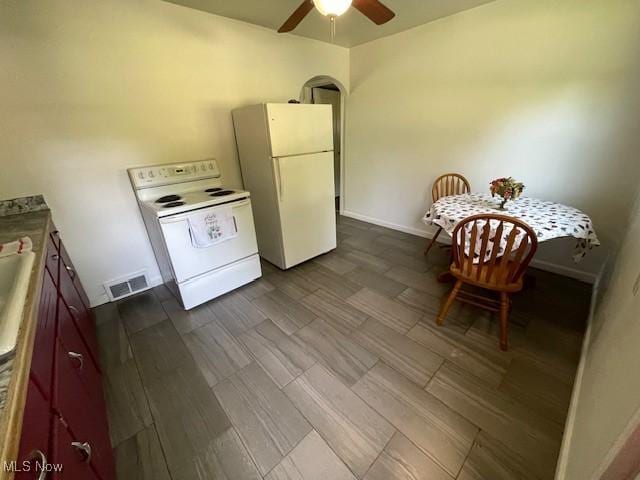 48555 Calcutta Smithferry Rd, East Liverpool, OH 43920 - kitchen with white appliances, a ceiling fan, dark wood finished floors, and baseboards