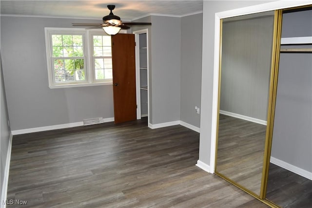 1408 N 9th St, Martins Ferry, OH 43935 - unfurnished bedroom with a closet, ornamental molding, wood finished floors, and baseboards