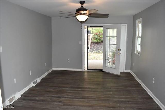 1408 N 9th St, Martins Ferry, OH 43935 - unfurnished dining area with a ceiling fan, dark wood-type flooring, and baseboards
