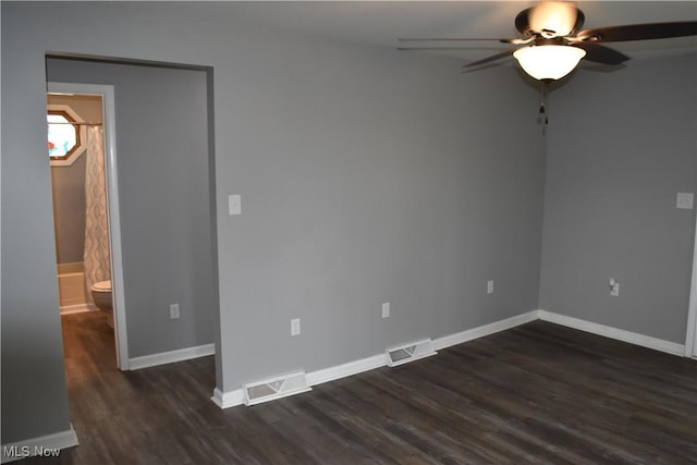 1408 N 9th St, Martins Ferry, OH 43935 - unfurnished room featuring ceiling fan, dark wood-style floors, and baseboards
