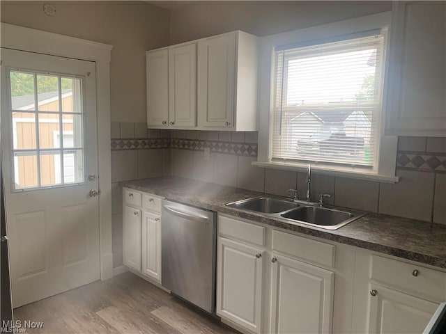 3961 E 53rd St, Newburgh Heights, OH 44105 - kitchen featuring dishwasher, a sink, white cabinets, and light wood-type flooring
