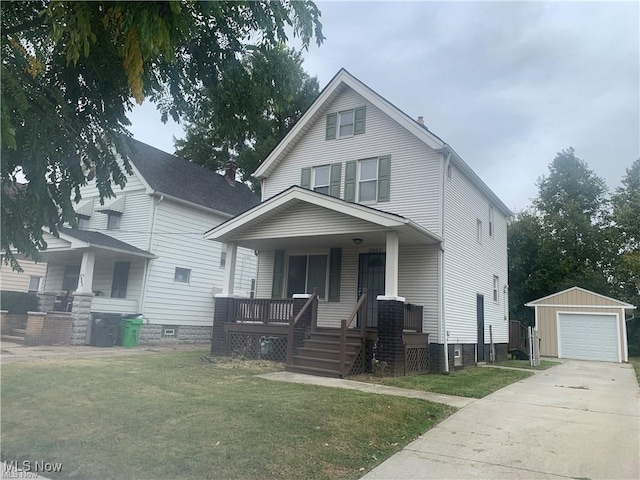 3961 E 53rd St, Newburgh Heights, OH 44105 - traditional style home with covered porch, an outdoor structure, a front yard, driveway, and a garage