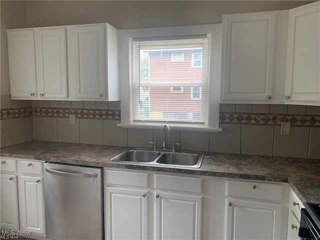 3961 E 53rd St, Newburgh Heights, OH 44105 - kitchen featuring dishwasher, a sink, white cabinetry, and backsplash