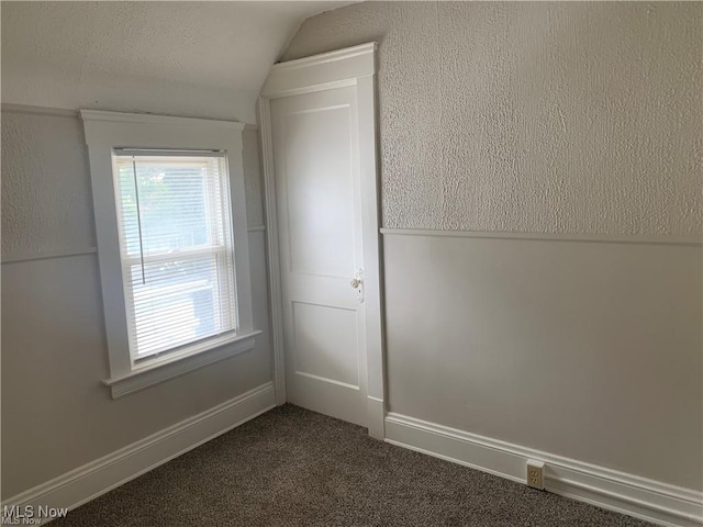 3961 E 53rd St, Newburgh Heights, OH 44105 - carpeted spare room featuring vaulted ceiling and baseboards