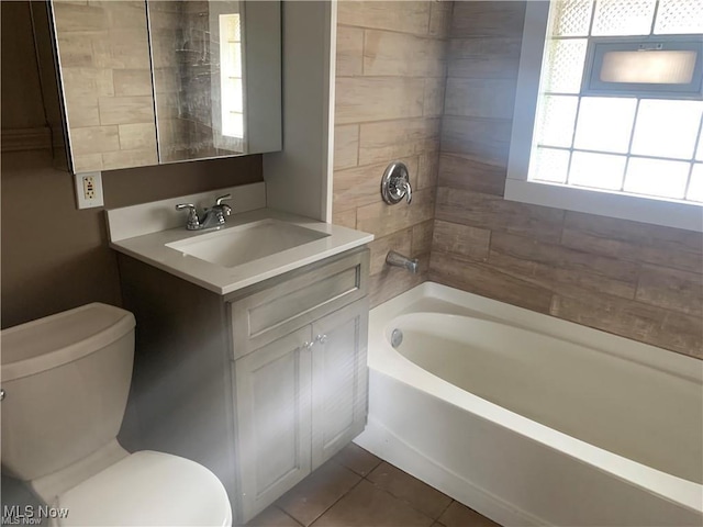 3961 E 53rd St, Newburgh Heights, OH 44105 - bathroom with toilet, vanity, tile patterned flooring, and shower / washtub combination