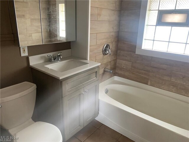 3961 E 53rd St, Newburgh Heights, OH 44105 - full bath with vanity, tile patterned flooring, and shower / tub combination