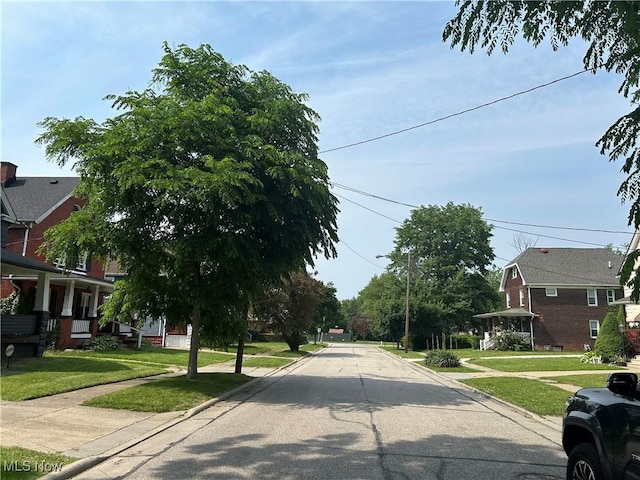 3961 E 53rd St, Newburgh Heights, OH 44105 - view of asphalt street featuring curbs and sidewalks