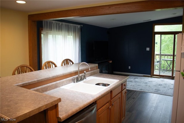 1553 Quail Hollow Dr, Cambridge, OH 43725 - kitchen featuring stainless steel dishwasher, dark wood finished floors, light countertops, brown cabinets, and recessed lighting