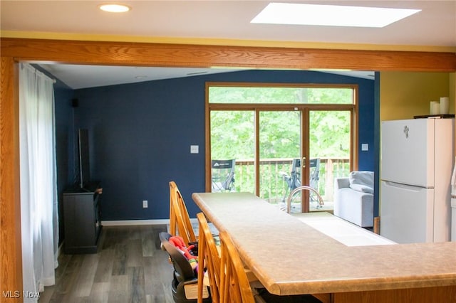 1553 Quail Hollow Dr, Cambridge, OH 43725 - dining room featuring a skylight, wood finished floors, and recessed lighting