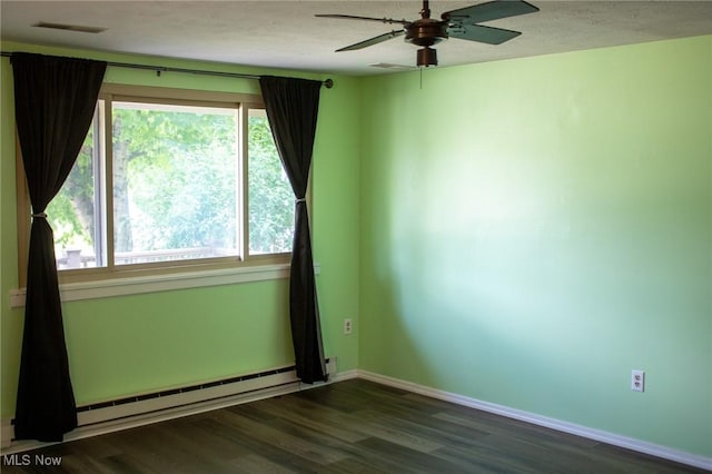 1553 Quail Hollow Dr, Cambridge, OH 43725 - empty room with a baseboard heating unit, ceiling fan, and dark wood finished floors