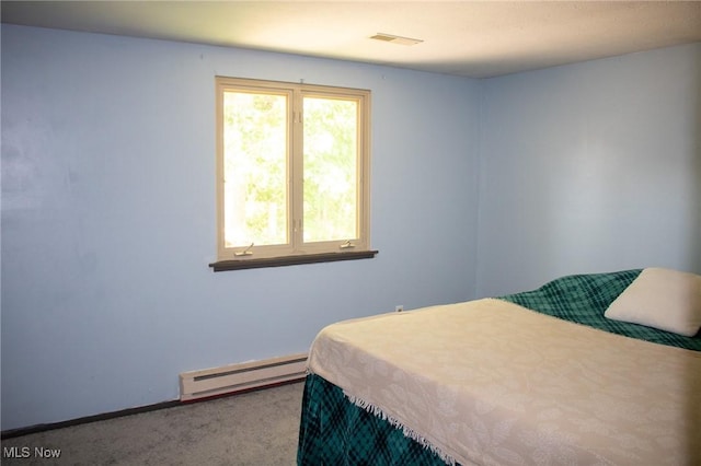 1553 Quail Hollow Dr, Cambridge, OH 43725 - bedroom featuring baseboard heating and carpet floors