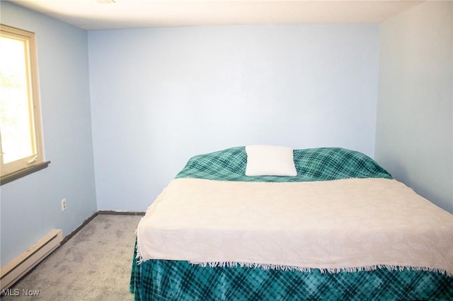 1553 Quail Hollow Dr, Cambridge, OH 43725 - bedroom featuring a baseboard heating unit and light carpet
