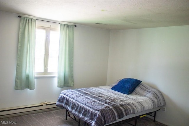 1553 Quail Hollow Dr, Cambridge, OH 43725 - bedroom featuring a baseboard radiator and carpet floors