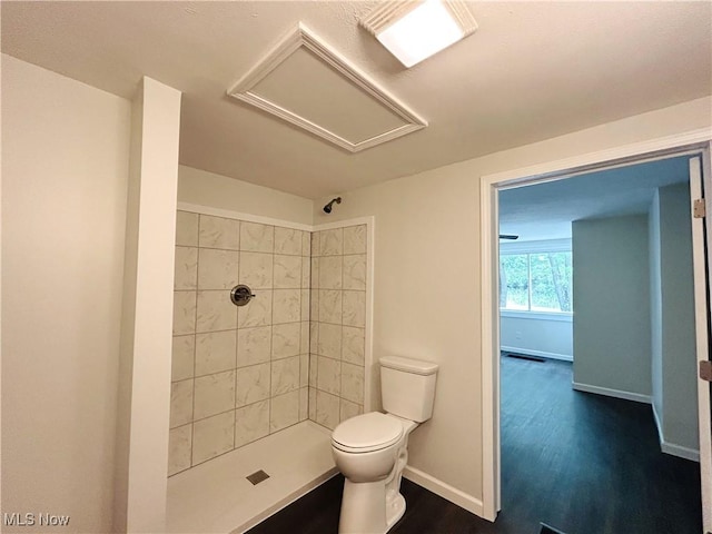 2815 Race Track Rd, New Cumberland, WV 26047 - full bathroom featuring a tile shower, toilet, wood finished floors, and baseboards