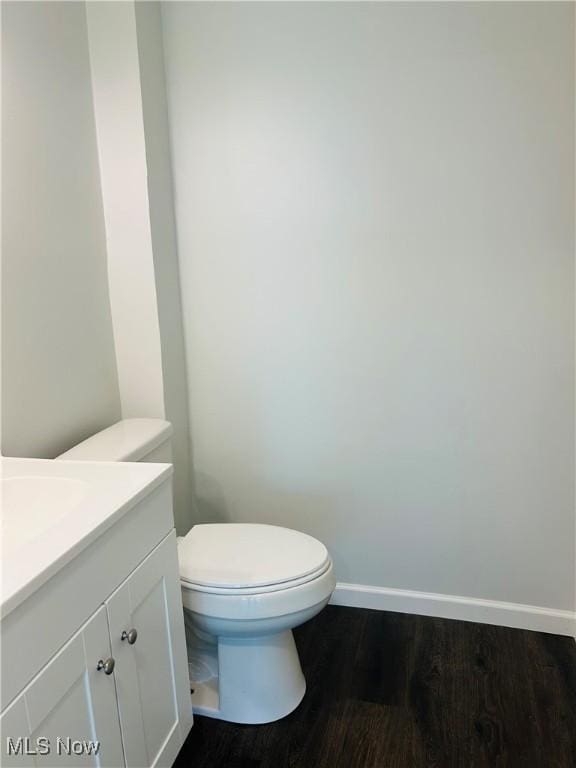 2815 Race Track Rd, New Cumberland, WV 26047 - half bathroom with vanity, wood finished floors, toilet, and baseboards