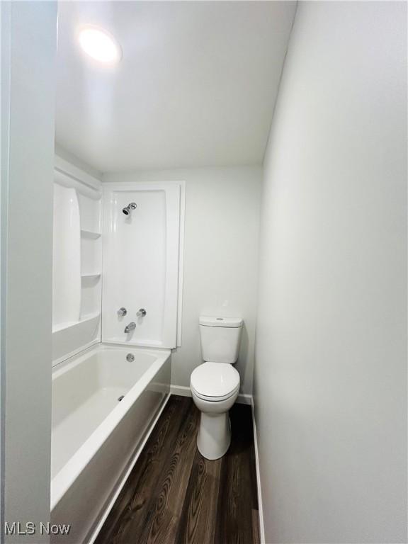 2815 Race Track Rd, New Cumberland, WV 26047 - bathroom with wood finished floors, toilet, shower / bathtub combination, and baseboards