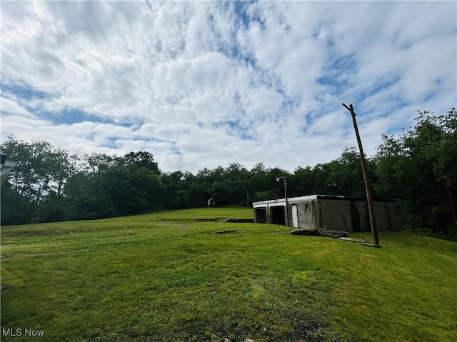 2815 Race Track Rd, New Cumberland, WV 26047 - view of green lawn featuring an outbuilding and a forest view