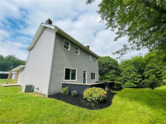 2815 Race Track Rd, New Cumberland, WV 26047 - back of property featuring a chimney, a lawn, and central air condition unit