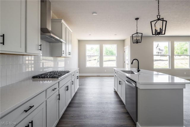 3730 Overlook Ct, Akron, OH 44333 - kitchen featuring wall chimney exhaust hood, appliances with stainless steel finishes, dark wood finished floors, backsplash, and light countertops