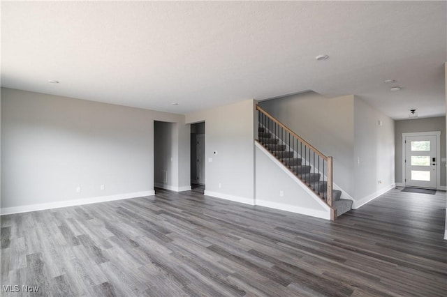 3730 Overlook Ct, Akron, OH 44333 - unfurnished living room featuring stairs and wood finished floors