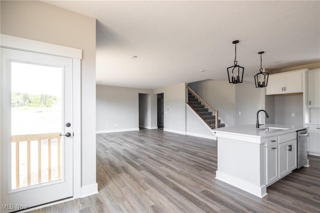 3730 Overlook Ct, Akron, OH 44333 - kitchen with stainless steel dishwasher, plenty of natural light, light wood-type flooring, and white cabinetry