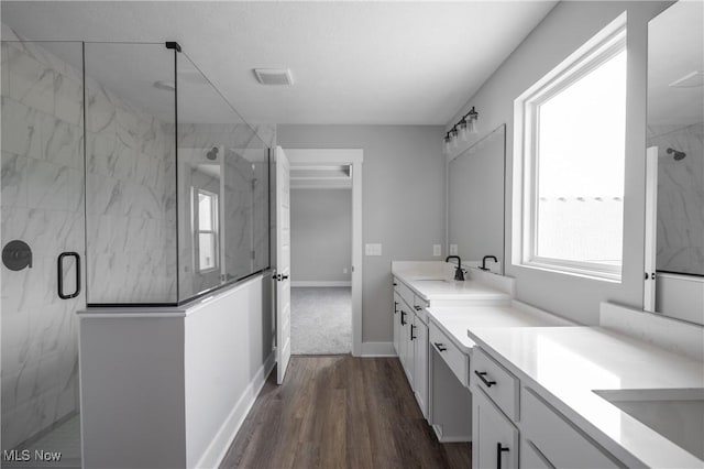 3730 Overlook Ct, Akron, OH 44333 - bathroom featuring vanity, a marble finish shower, and wood finished floors