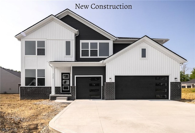 3730 Overlook Ct, Akron, OH 44333 - modern inspired farmhouse with brick siding, board and batten siding, and concrete driveway