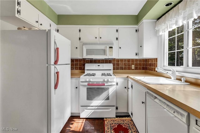 1783 Maywood Rd, South Euclid, OH 44121 - kitchen featuring white appliances, a sink, white cabinetry, light countertops, and tasteful backsplash