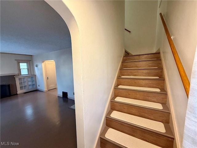 3427 Elm St, Weirton, WV 26062 - stairs featuring arched walkways and baseboards