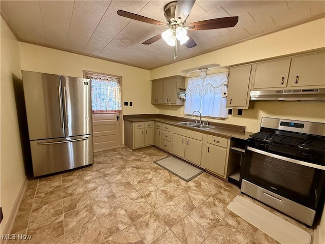 3427 Elm St, Weirton, WV 26062 - kitchen with stainless steel appliances, under cabinet range hood, a ceiling fan, dark countertops, and cream cabinets