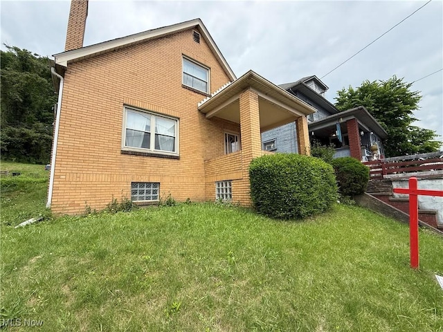 3427 Elm St, Weirton, WV 26062 - view of side of home featuring a chimney and brick siding