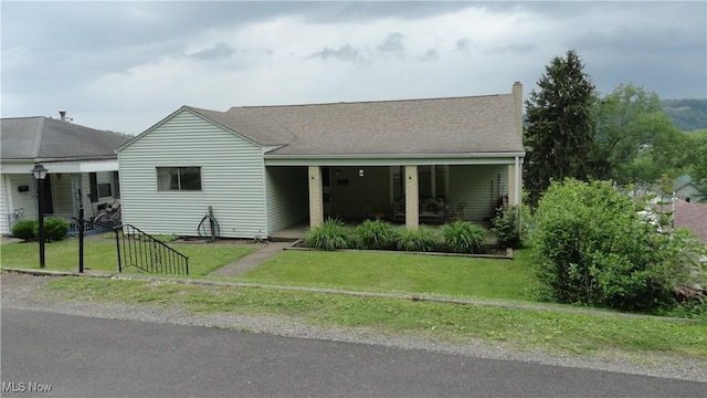521 Georgia Ave, Chester, WV 26034 - view of front of property with covered porch, a front yard, and a shingled roof