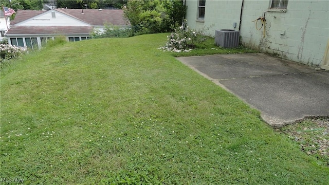 521 Georgia Ave, Chester, WV 26034 - view of green lawn with central AC and a patio