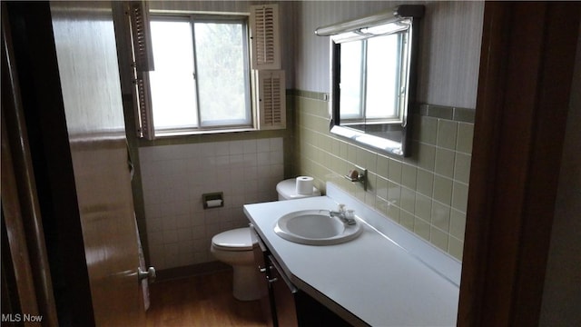 521 Georgia Ave, Chester, WV 26034 - bathroom with toilet, vanity, tile walls, and wood finished floors