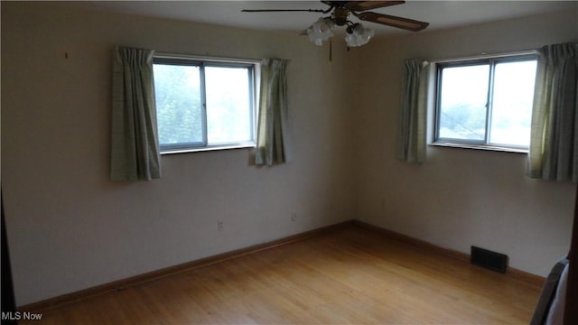 521 Georgia Ave, Chester, WV 26034 - spare room featuring plenty of natural light, light wood-style floors, a ceiling fan, and baseboards
