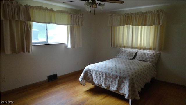521 Georgia Ave, Chester, WV 26034 - bedroom featuring wood finished floors and ceiling fan