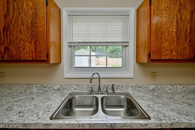 2312 Midway Ave NE, Canton, OH 44705 - kitchen with a sink and light countertops