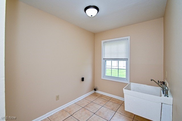 2312 Midway Ave NE, Canton, OH 44705 - washroom with baseboards and light tile patterned floors