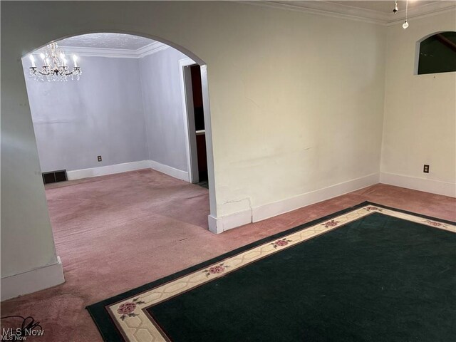 615 Noah Ave, Akron, OH 44320 - carpeted empty room with crown molding, arched walkways, and baseboards