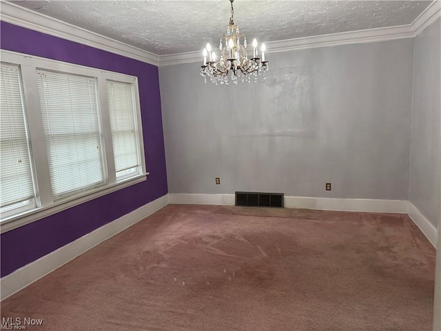 615 Noah Ave, Akron, OH 44320 - empty room featuring a chandelier, carpet floors, a textured ceiling, baseboards, and crown molding
