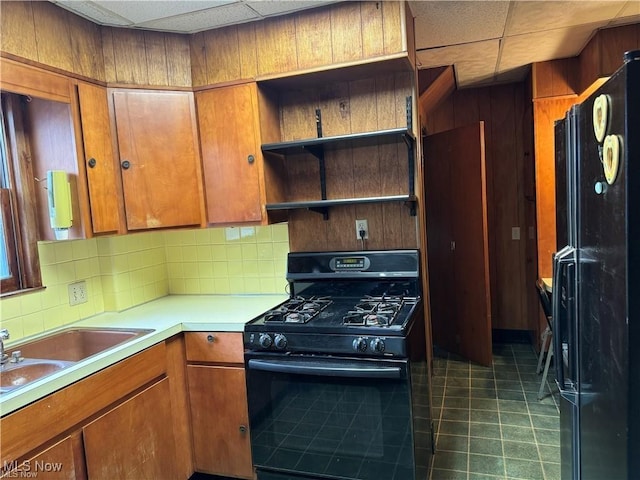 615 Noah Ave, Akron, OH 44320 - kitchen with black appliances, open shelves, backsplash, brown cabinetry, and a drop ceiling