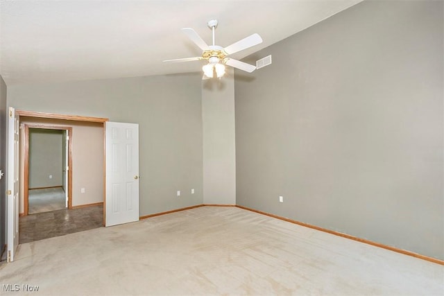3840 Dartford Ln, Medina, OH 44256 - unfurnished room with light colored carpet, ceiling fan, baseboards, and lofted ceiling